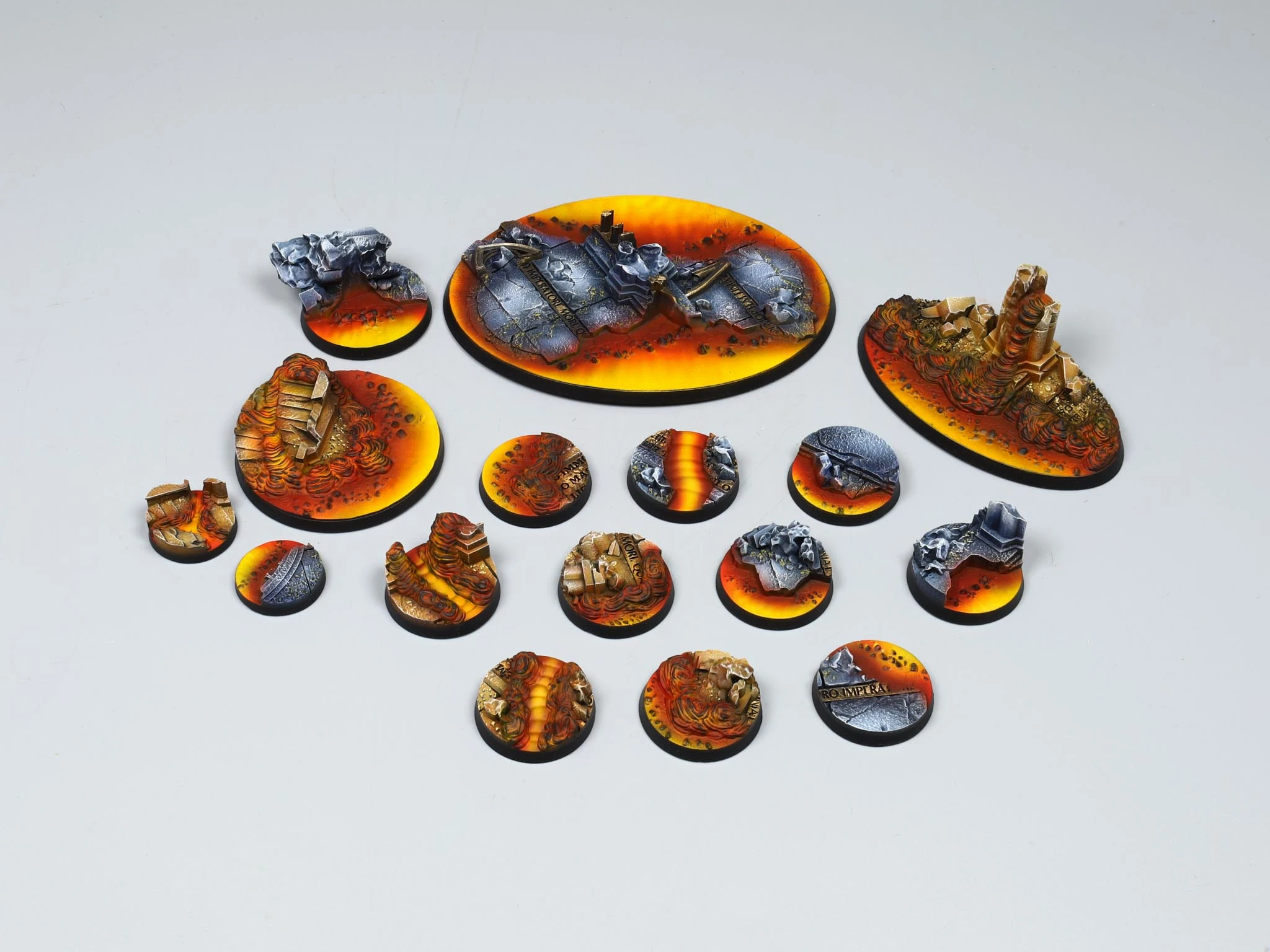Red cracked-earth miniature bases with skeleton fragments and dry vegetation