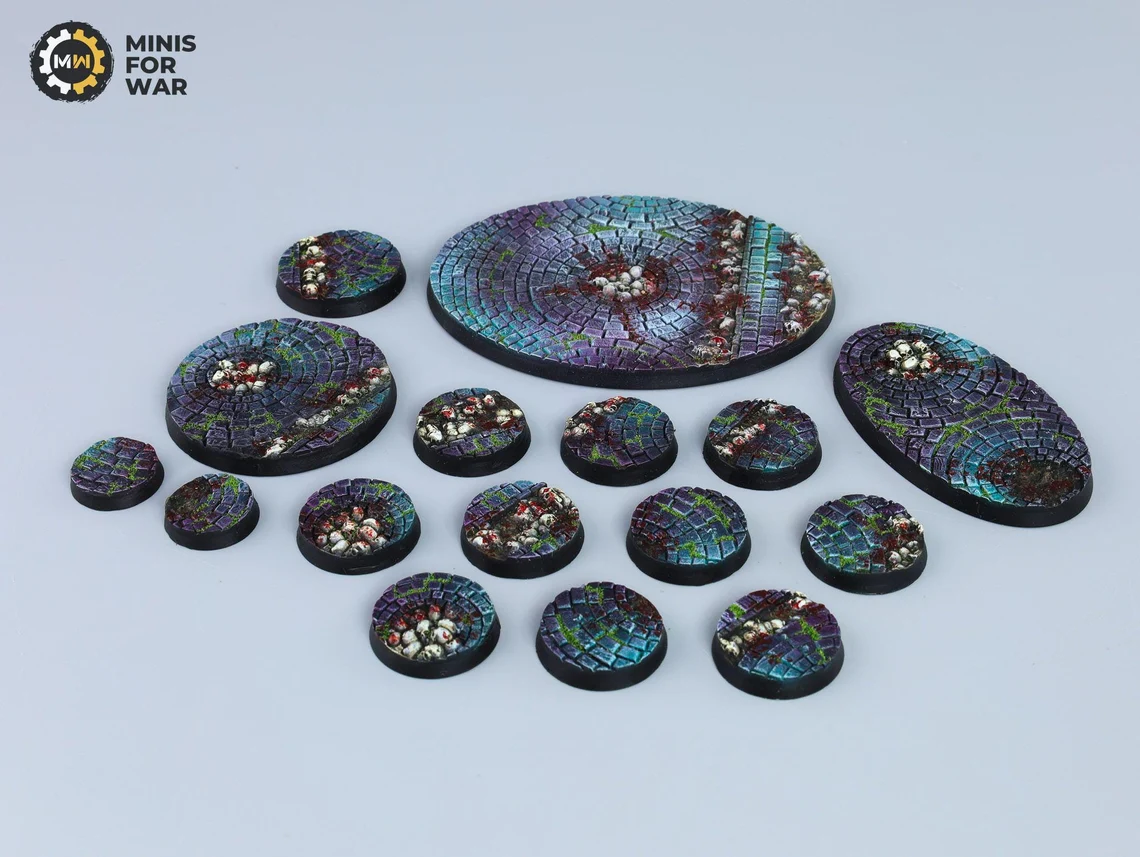 Colorful cobblestone miniature bases with eerie lighting and bone piles