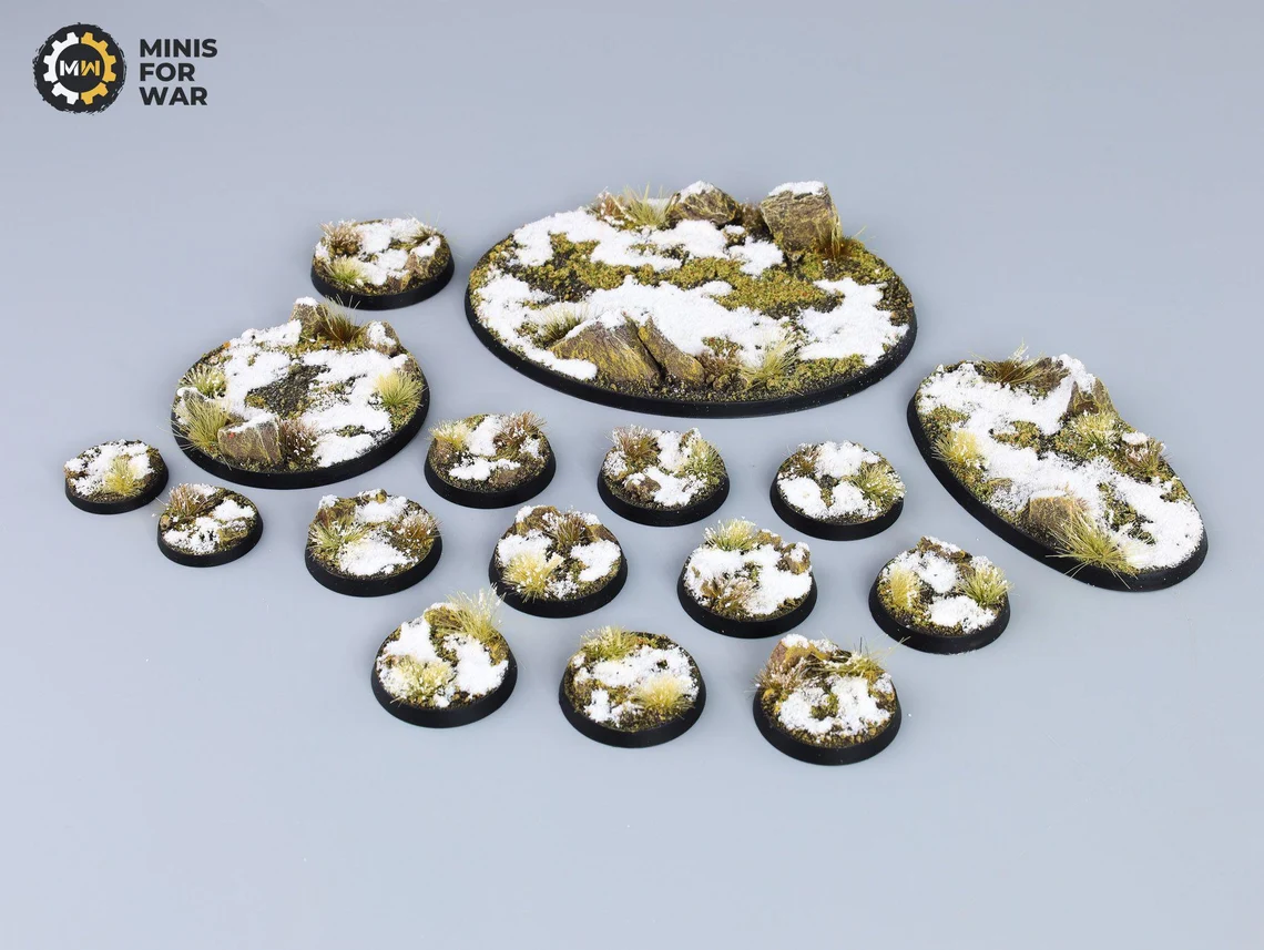 Frozen tundra miniature bases with mixed snow patches and mossy textures