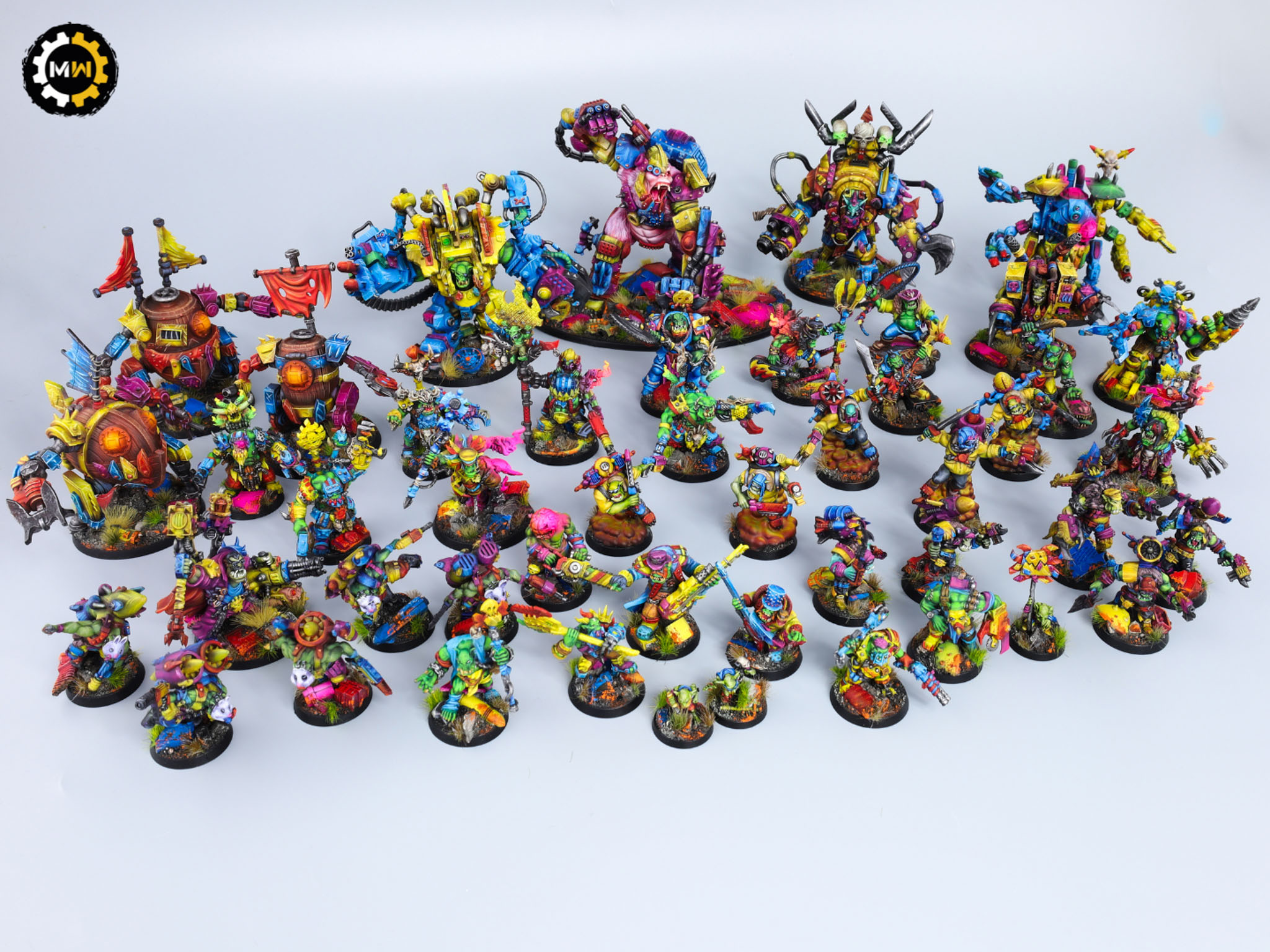 Large 3D-printed Ork army for Warhammer 40k, featuring custom-painted models in vibrant colors.