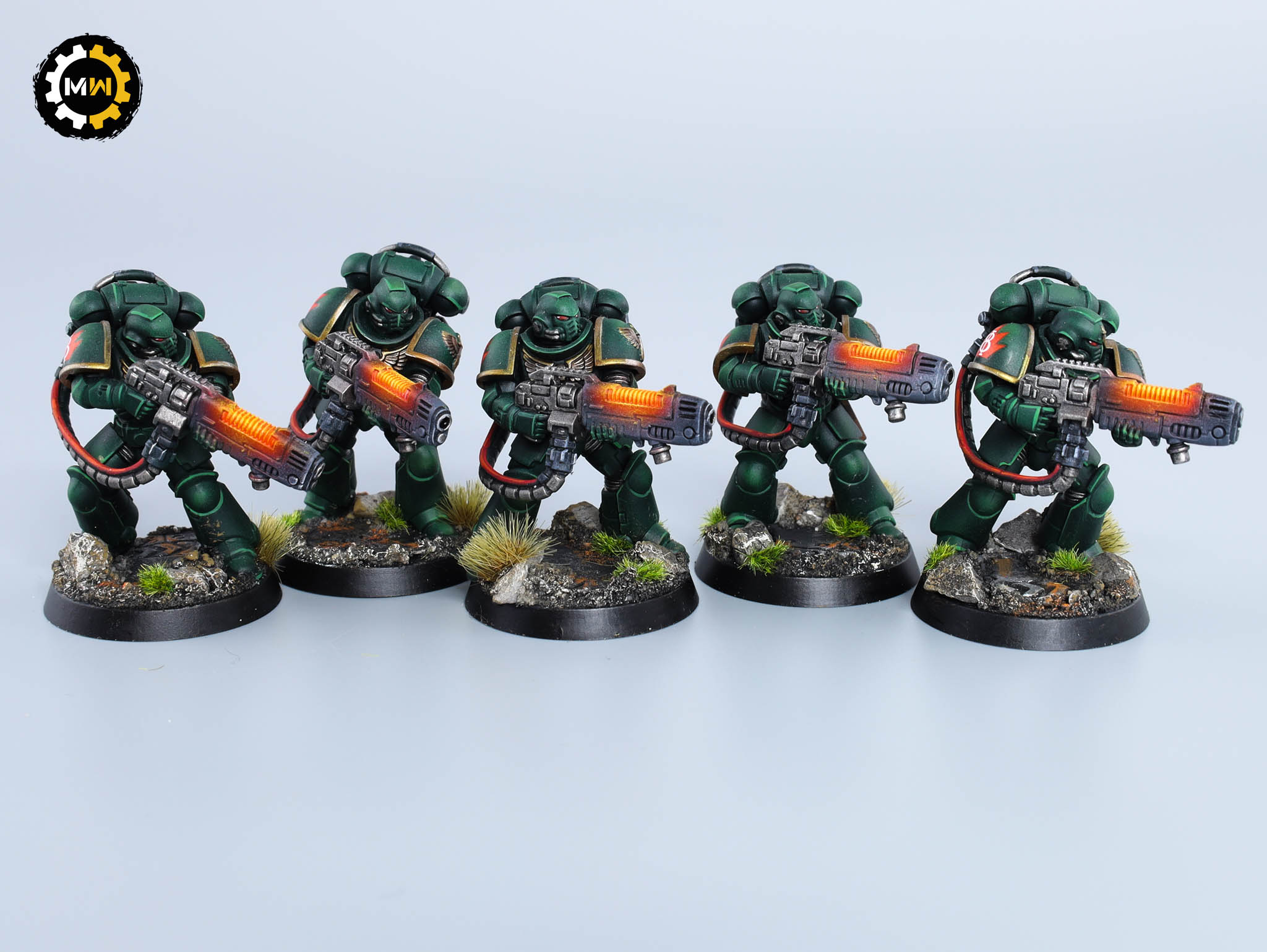 Dark Angels Army Primaris Hellblasters painted in green armor, equipped with glowing plasma incinerators, displayed on scenic bases.